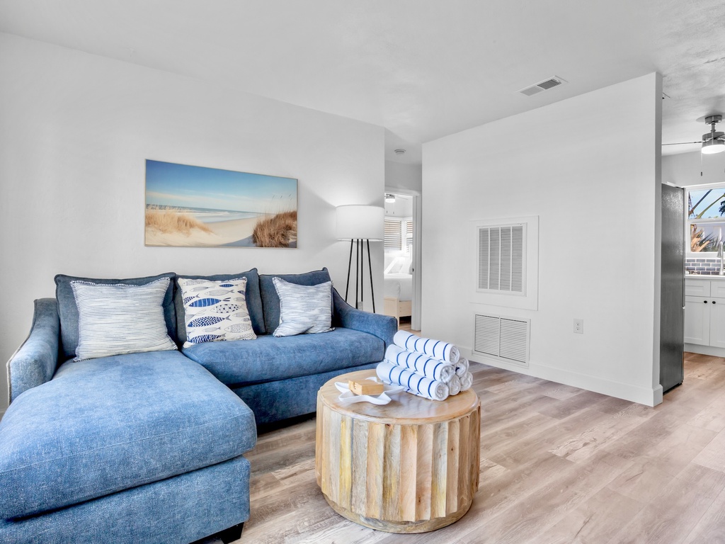 Living space with plush blue seating