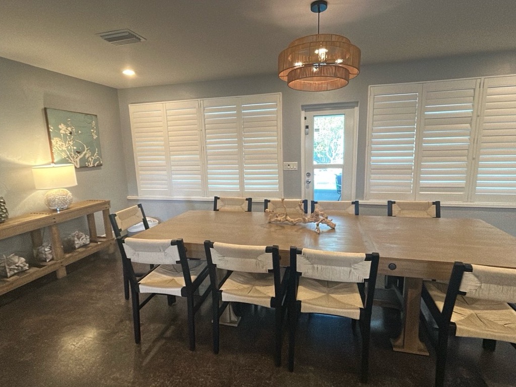 Gather around this stunning dining table for memorable meals with family and friends in this bright, elegantly appointed space.