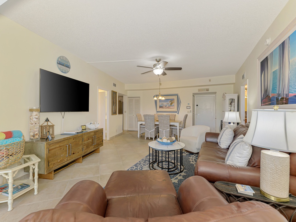 Sink into plush leather seating while enjoying your favorite shows on the large TV in this bright, open living space.