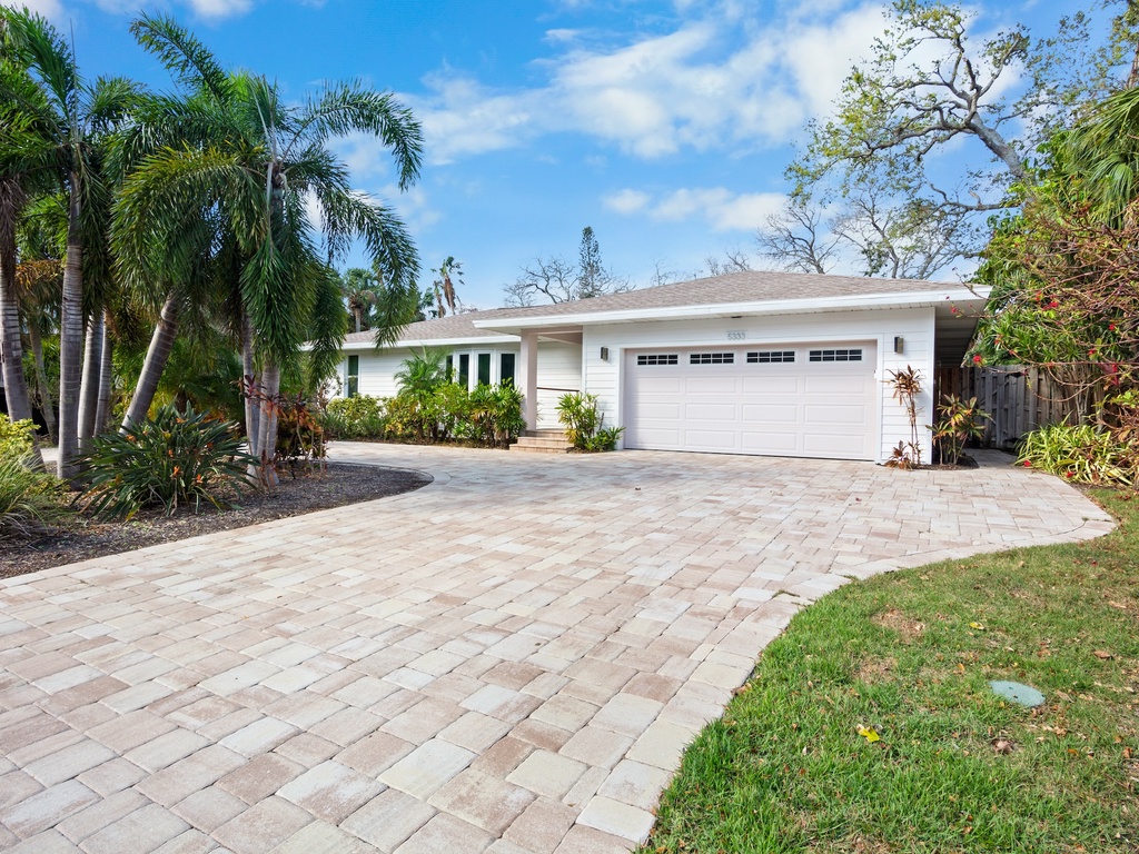 Spacious front yard with tropical landscaping