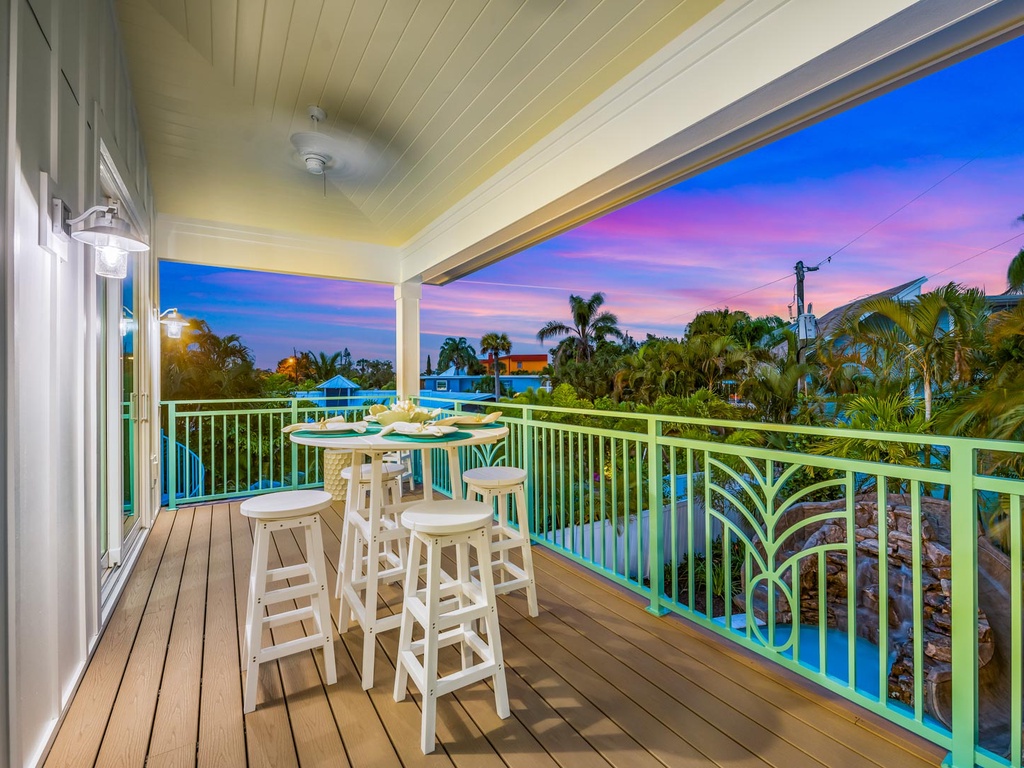 Balcony View of the Pool and Siesta Key Village at Sunset