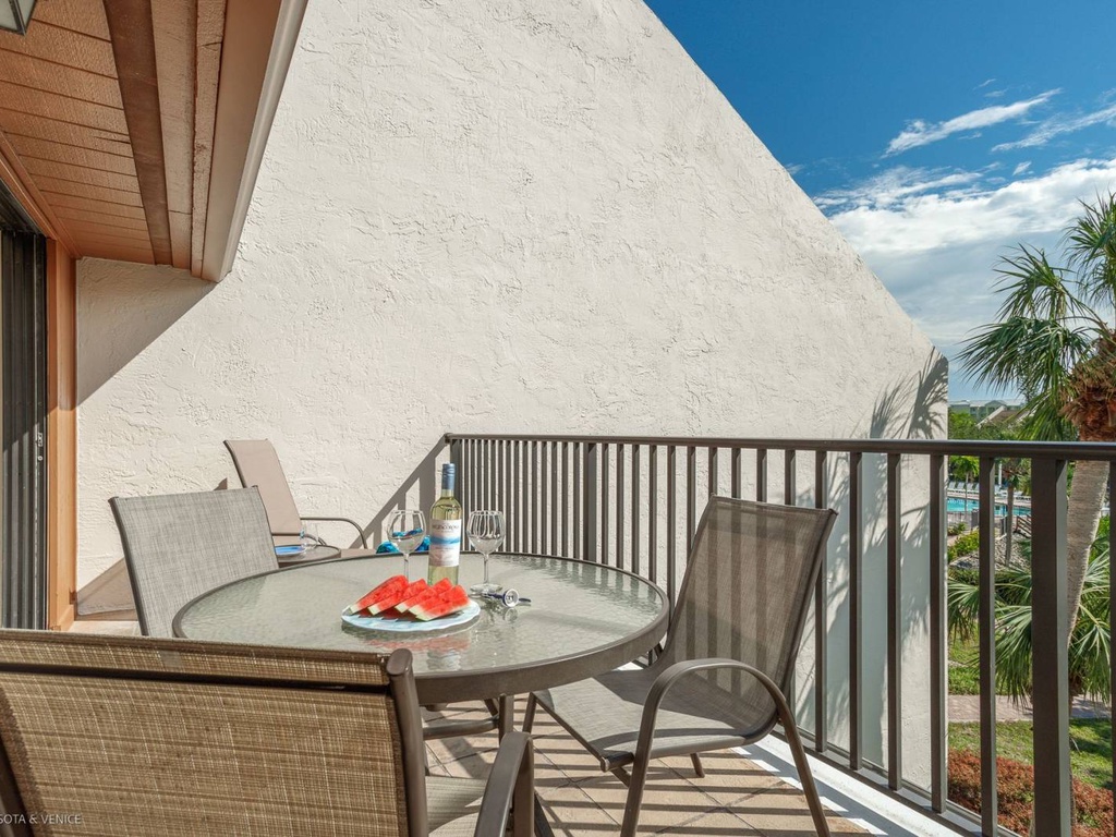 Sip morning coffee on your private balcony while tropical palms sway below and blue skies stretch endlessly above.