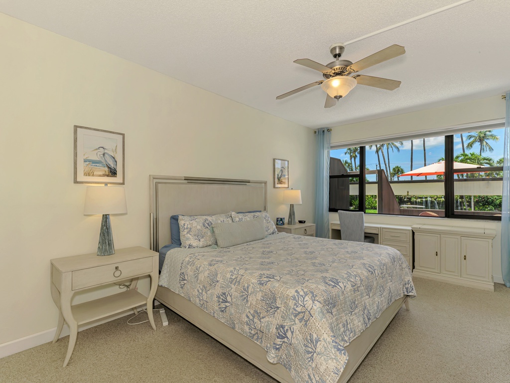 Wake up in your peaceful bedroom with tropical palm views and a gentle ceiling fan to keep you comfortable throughout the night.