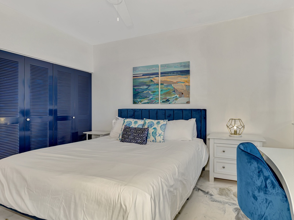 Drift off in your coastal-themed bedroom, where ocean blues and crisp whites create a serene sanctuary for restful nights.