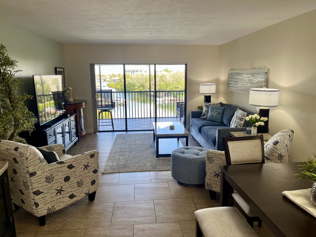 Relax in your stylish living space with comfortable seating and private balcony where you can unwind while taking in peaceful views.