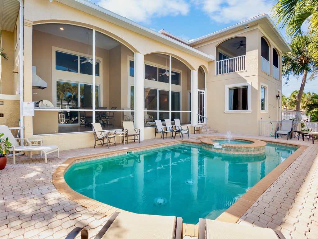 Private heated pool with spacious covered patio