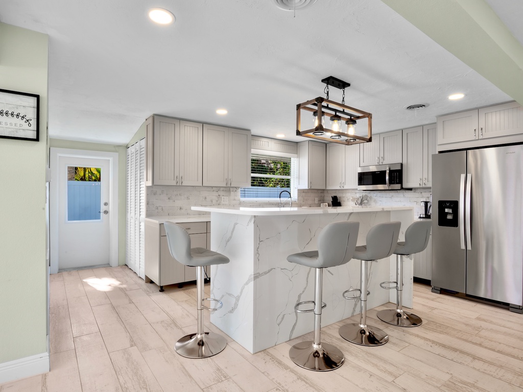 Kitchen with high top seating at breakfast bar