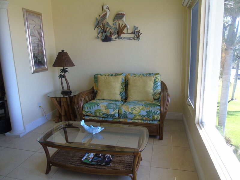 Screened lanai with comfortable seating