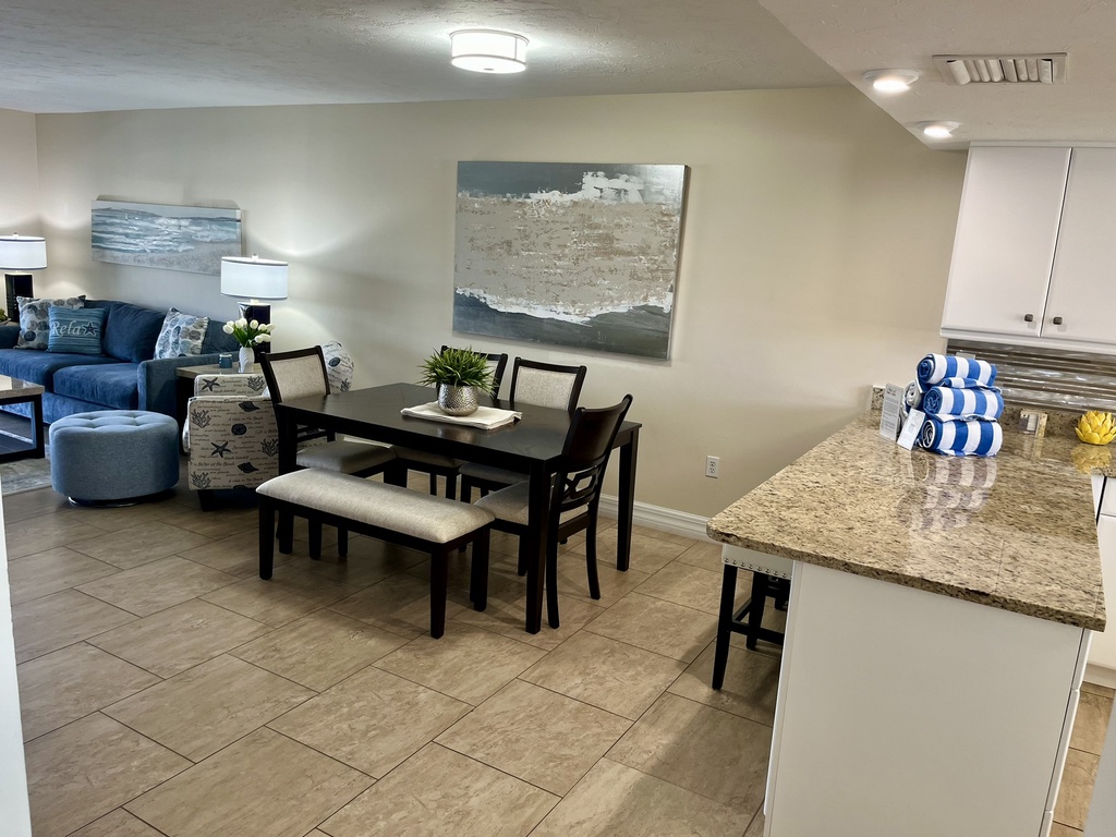 Your open-concept space seamlessly blends kitchen and dining, perfect for gathering over meals and creating vacation memories together.