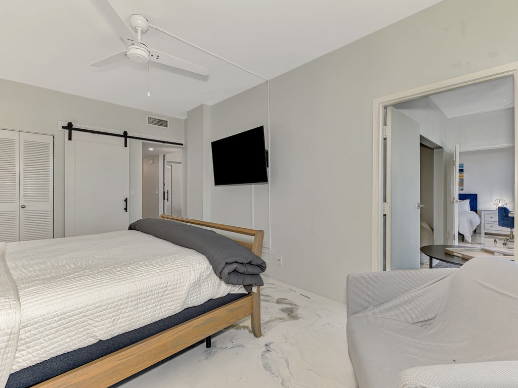 Unwind in your serene bedroom sanctuary with calming neutral tones, modern amenities, and thoughtful touches for ultimate relaxation.
