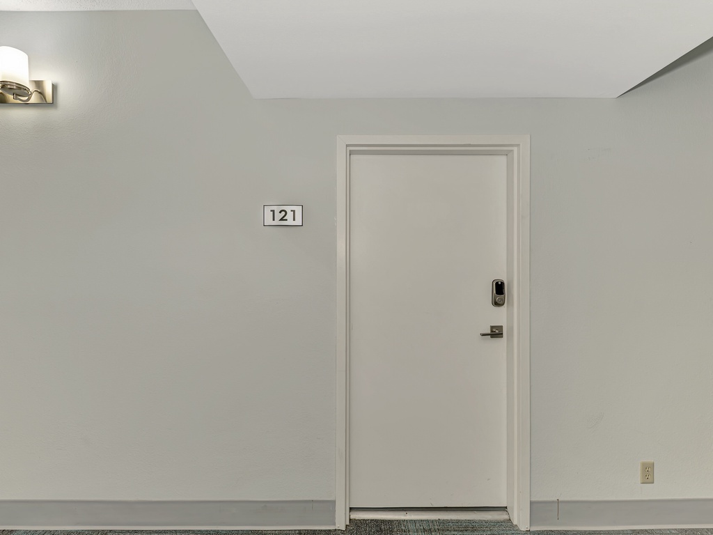 Your private entrance awaits behind door 121, leading to your comfortable retreat with modern amenities and thoughtful touches.