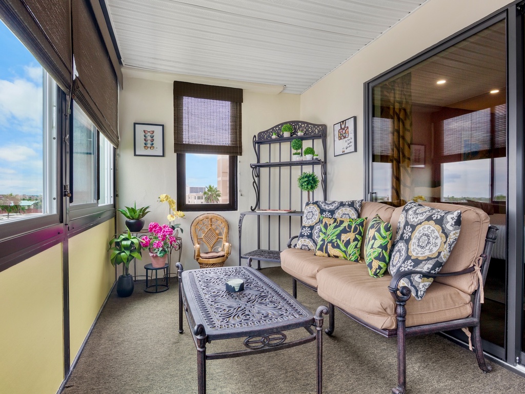 Screened outdoor space with lounge chairs