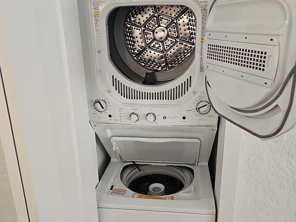 Your laundry needs are covered with this convenient stacked washer and dryer unit, tucked neatly into your space.