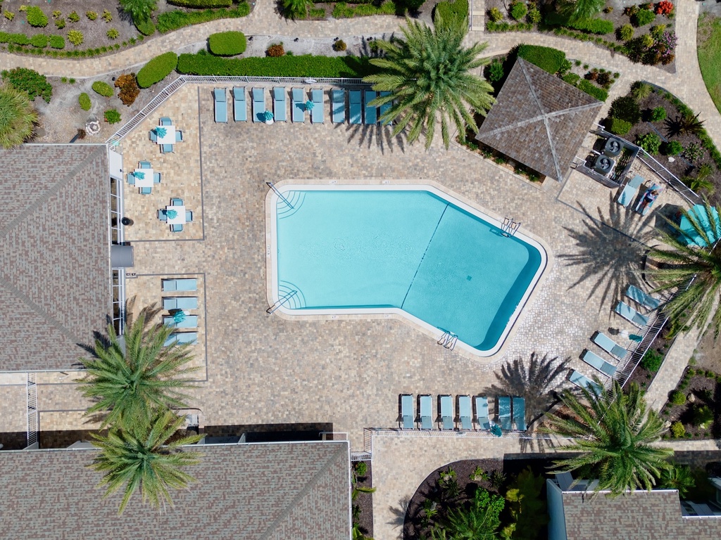 Shared heated pool with lounge chairs