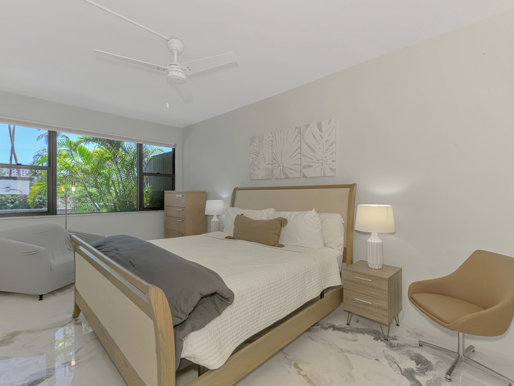 Drift off to sleep in your peaceful bedroom with garden views and modern comfort.