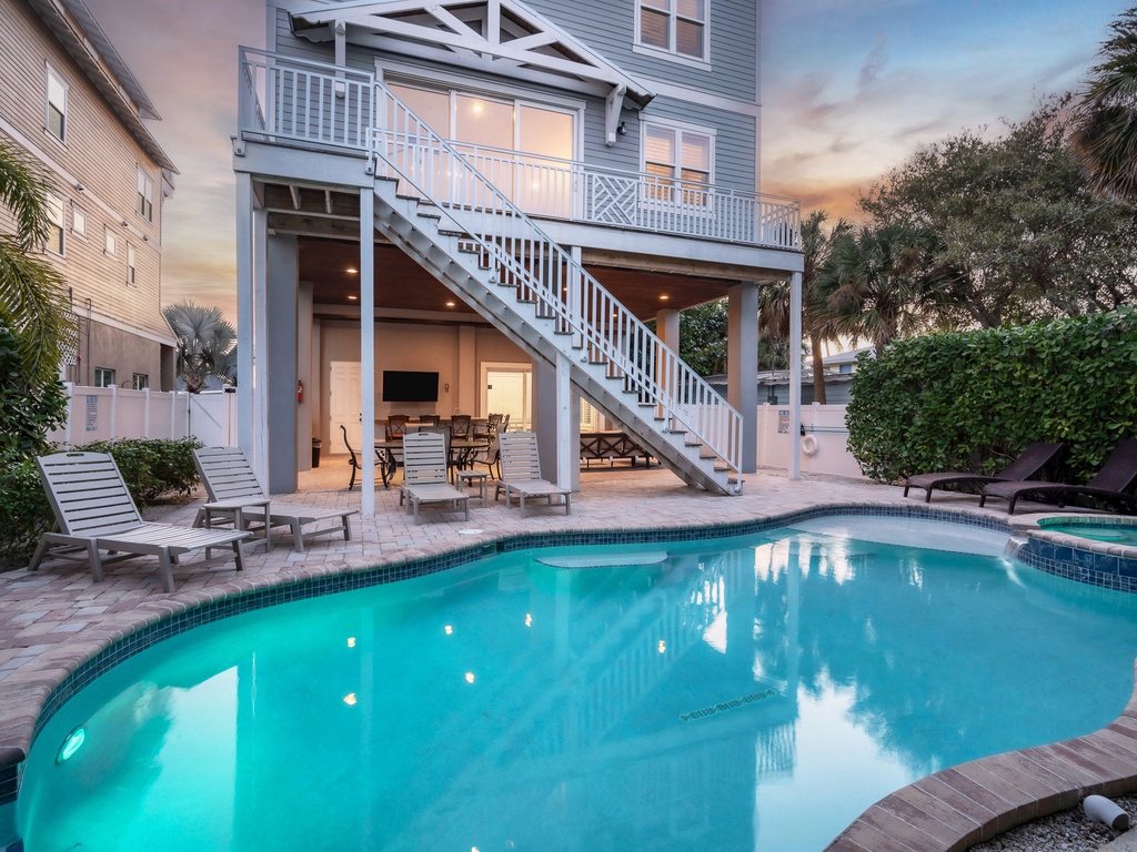 House featuring pool and spa amenities