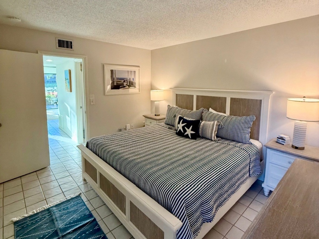 Sleep peacefully in your coastal bedroom with nautical touches and warm bedside lighting creating the perfect seaside retreat.