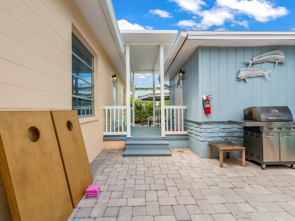 BBQ grill, beach chairs and two cornhole games