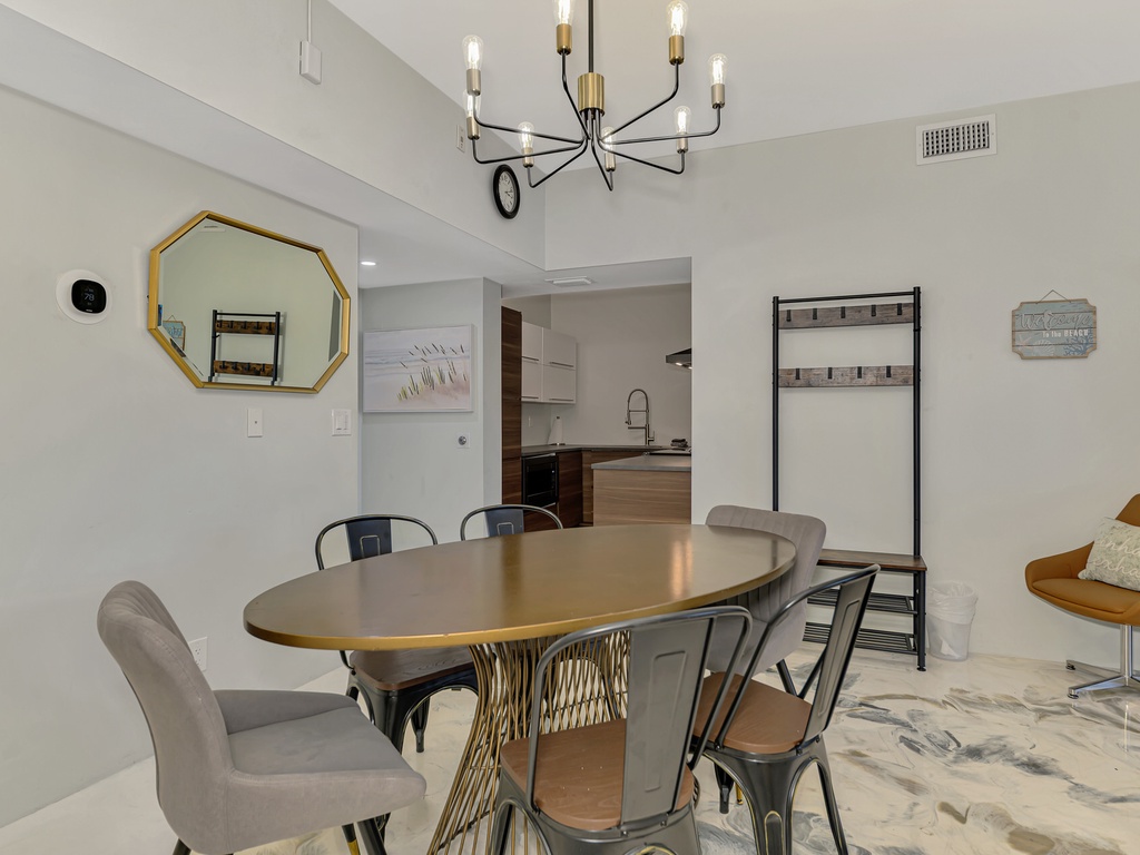 Gather around your stylish dining table for memorable meals, with modern pendant lighting creating perfect ambiance for intimate dinners.