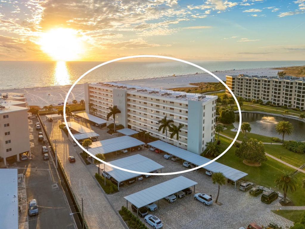 Beachfront property with stunning sunrise views over pristine sandy shores and coastal waters.
