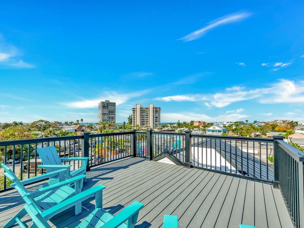 Rooftop deck with Adirondack seating and Gulf views