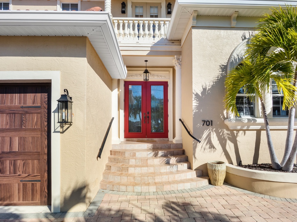 Welcoming entrance featuring striking red doors