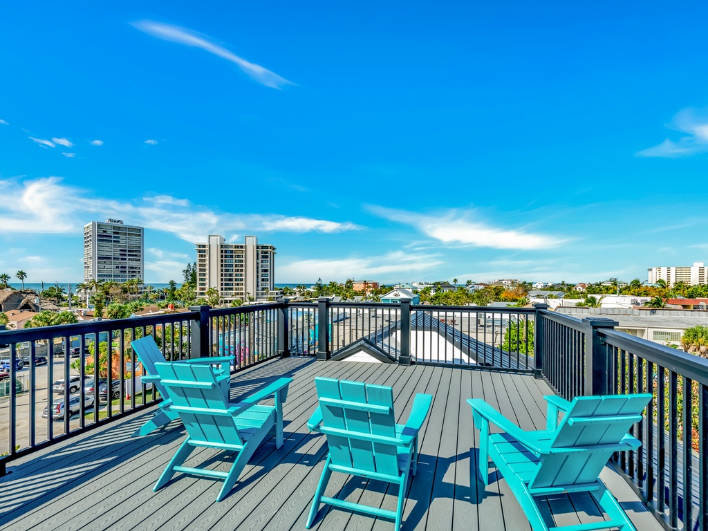 Rooftop deck with Adirondack seating and Gulf views
