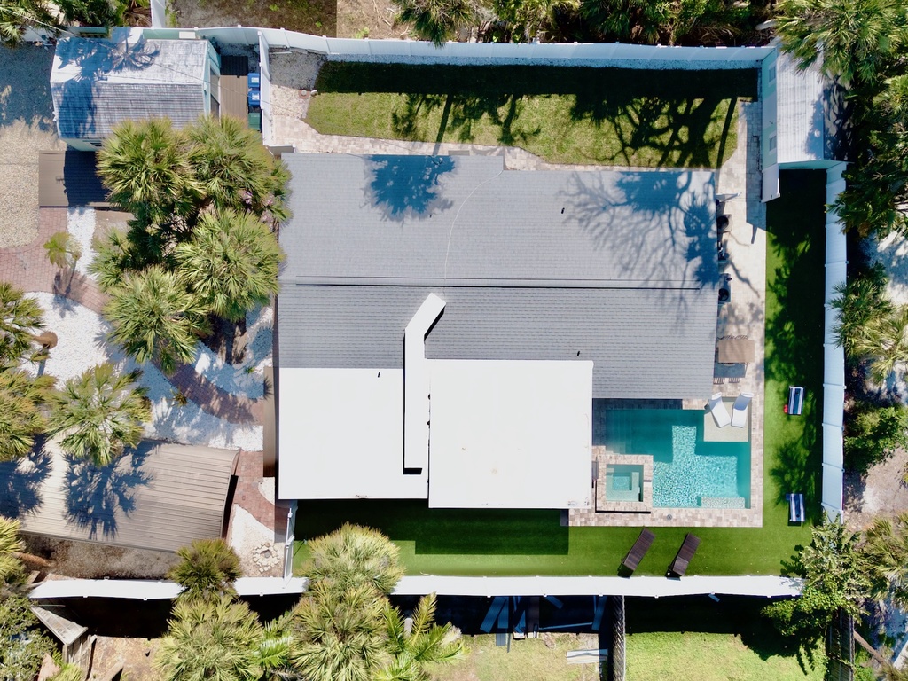 Aerial view of home with private pool and spa