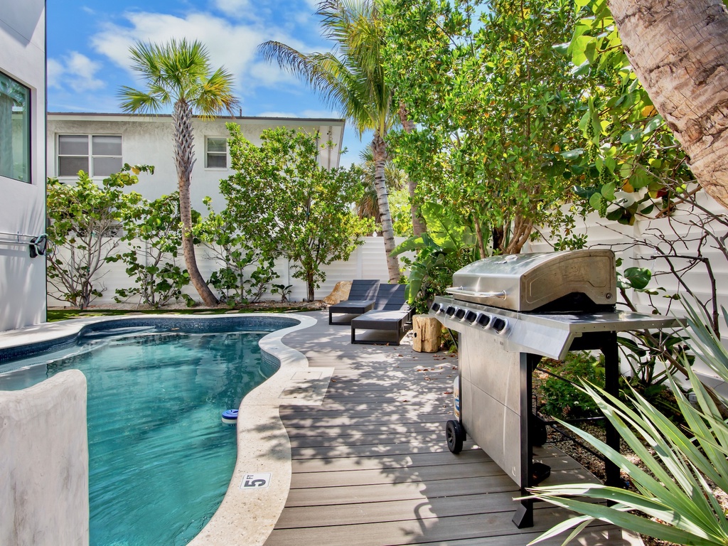 Poolside Water Slide, Loungers and BBQ