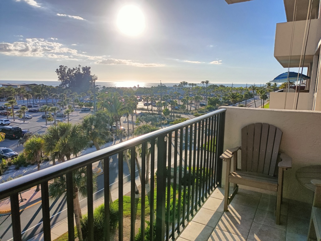 Unwind on your private balcony with a refreshing drink as you soak in stunning ocean views and tropical palm trees swaying in the breeze.