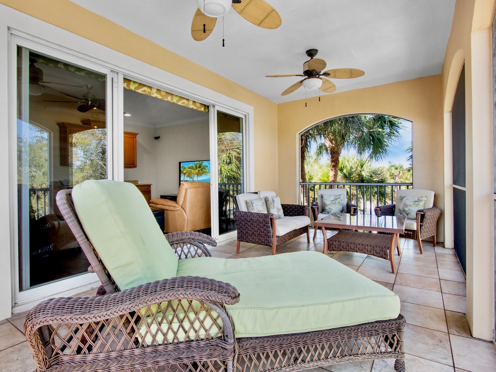 Private covered balcony with plush seating