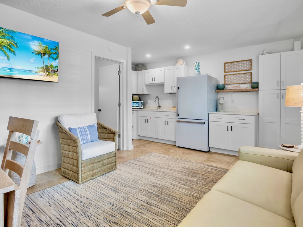 Unwind in your bright, coastal-themed space where tropical artwork and beachy blues create the perfect vacation vibe for cooking and relaxing.