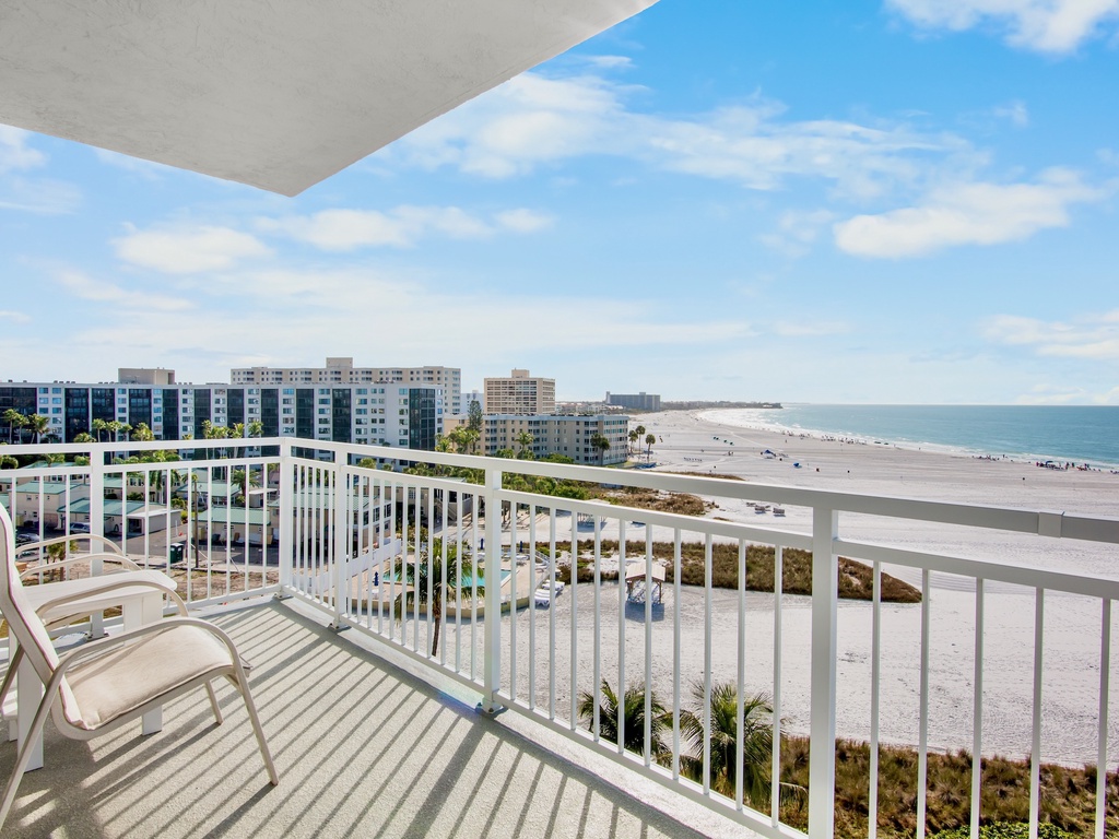 Expansive beach and ocean views stretch endlessly from this elevated balcony, offering a perfect vantage point of the pristine coastline below.