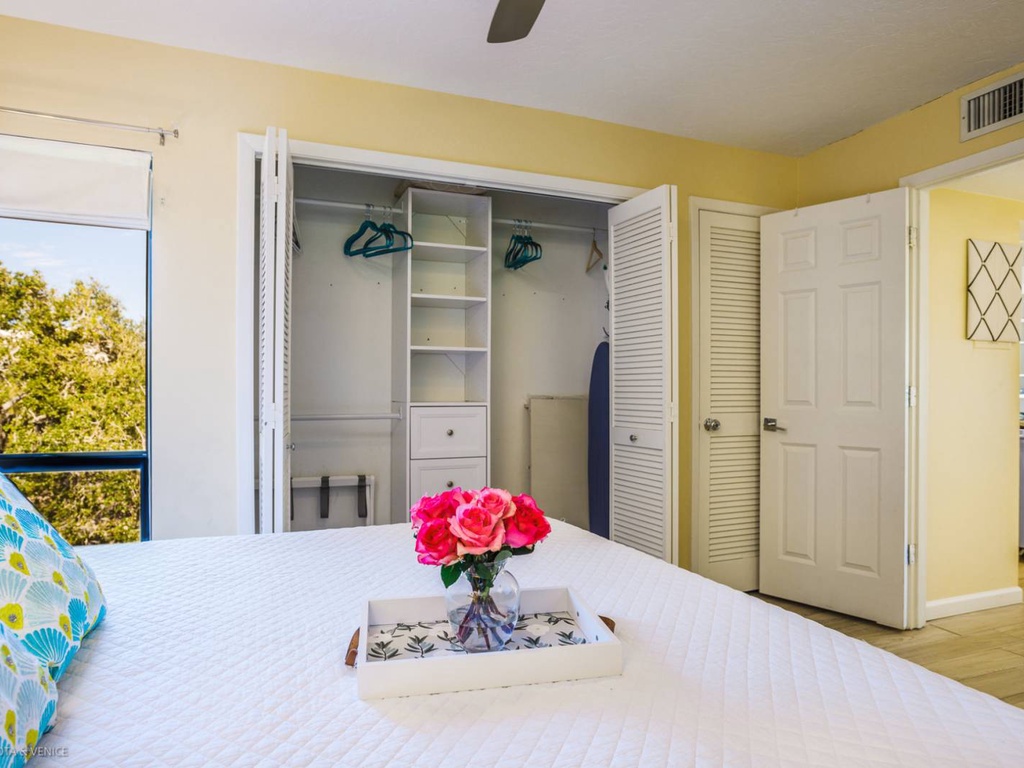 Rest easy in your bright, cheerful bedroom with ample closet space and fresh flowers welcoming you home each day.