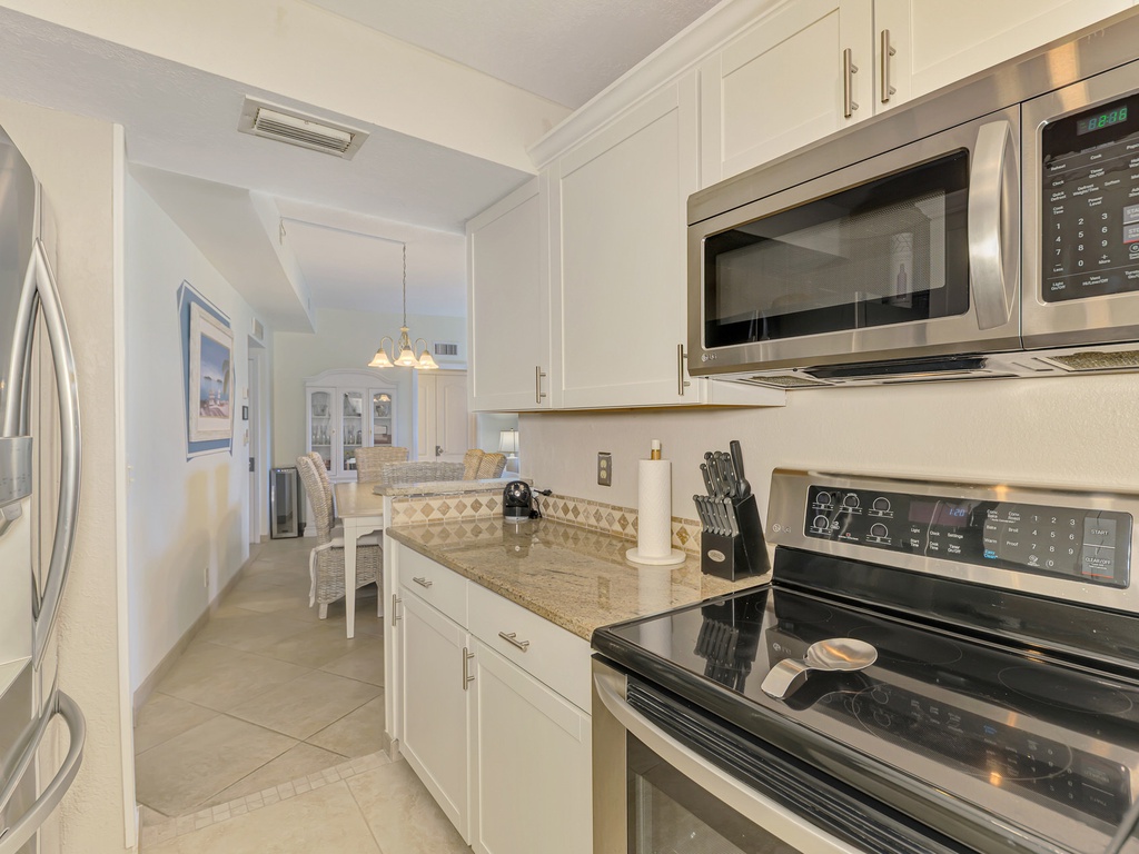 Your fully equipped kitchen features stainless steel appliances, granite counters, and everything you need to create memorable meals during your stay.