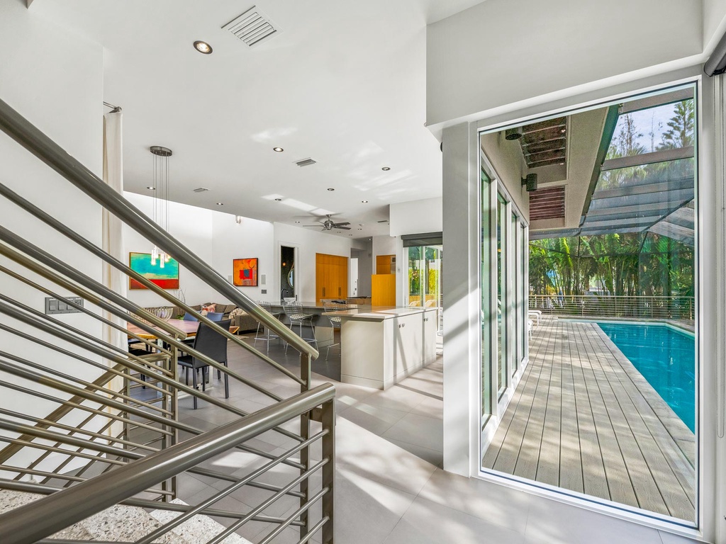 Staircase to Main Living Area - Glass Sliding Doors to Pool