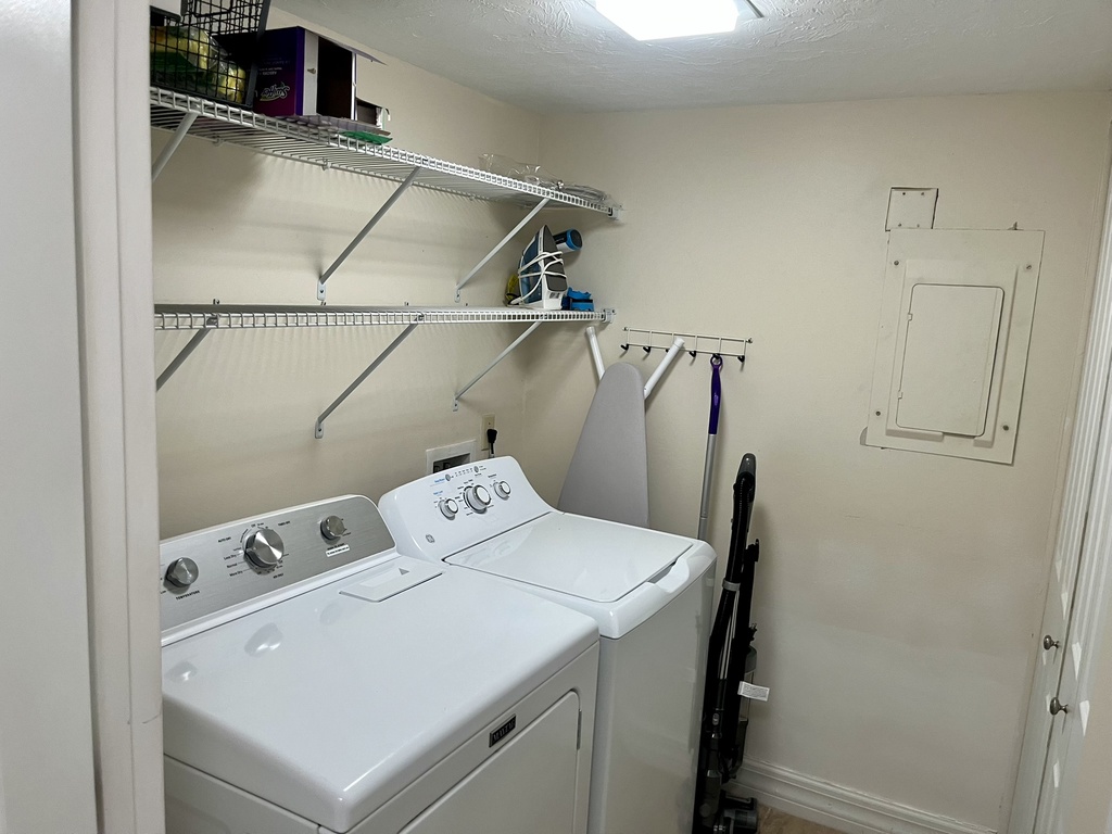 Your private laundry room keeps your stay hassle-free with full-size washer and dryer plus storage shelves for all your needs.