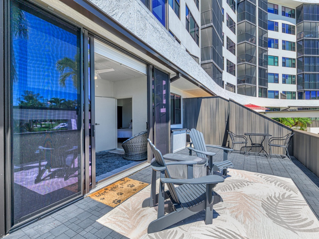 Step onto your private terrace and enjoy morning coffee or evening drinks with modern outdoor furniture and city views.