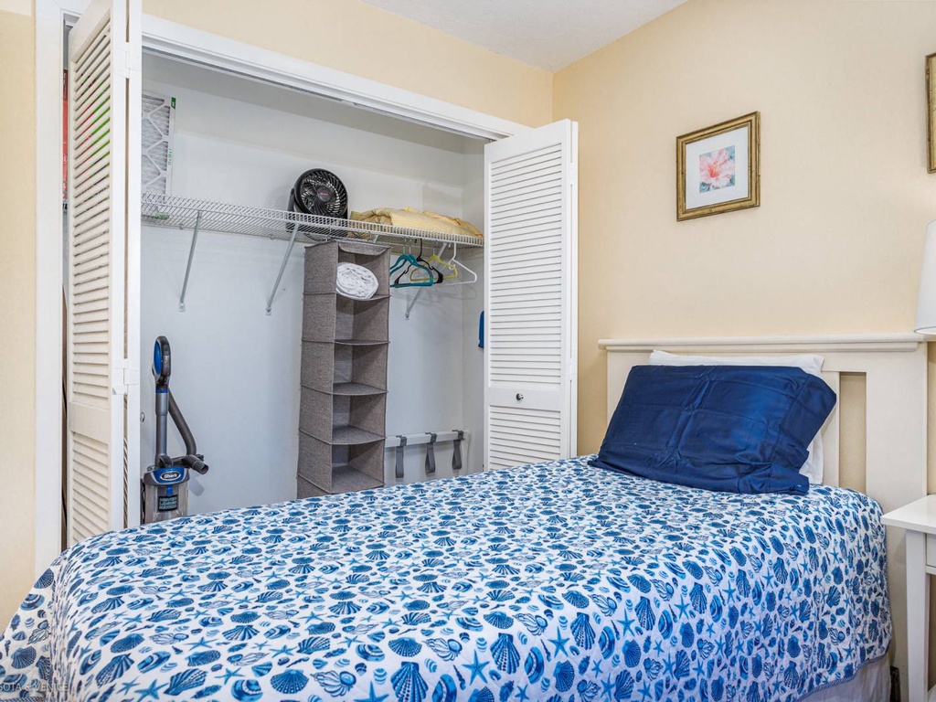 Settle into your cozy bedroom with thoughtful touches like ample closet space, organized storage, and coastal-inspired bedding for peaceful nights.