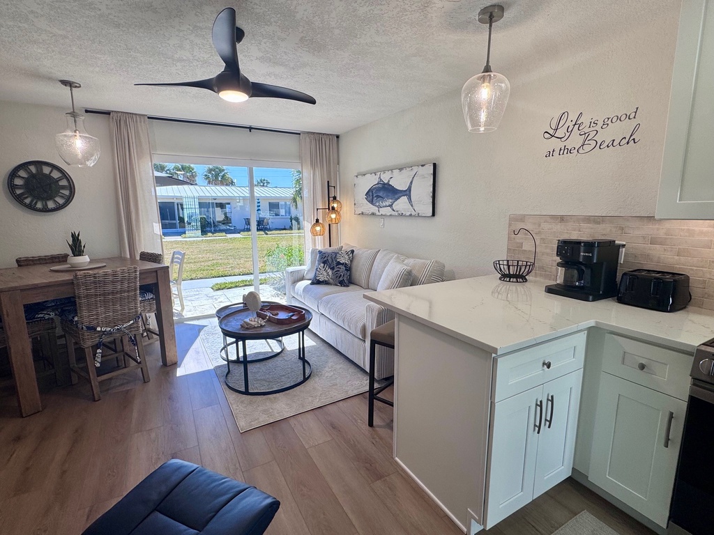 Relax in your coastal-inspired retreat with modern kitchen, cozy living space, and beach-themed touches that make you feel right at home.