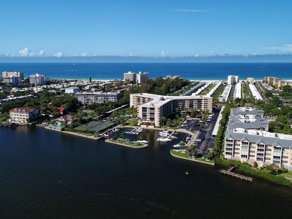 Aerial view of the waterfront community showcasing beachside buildings and coastal development in this scenic coastal destination.