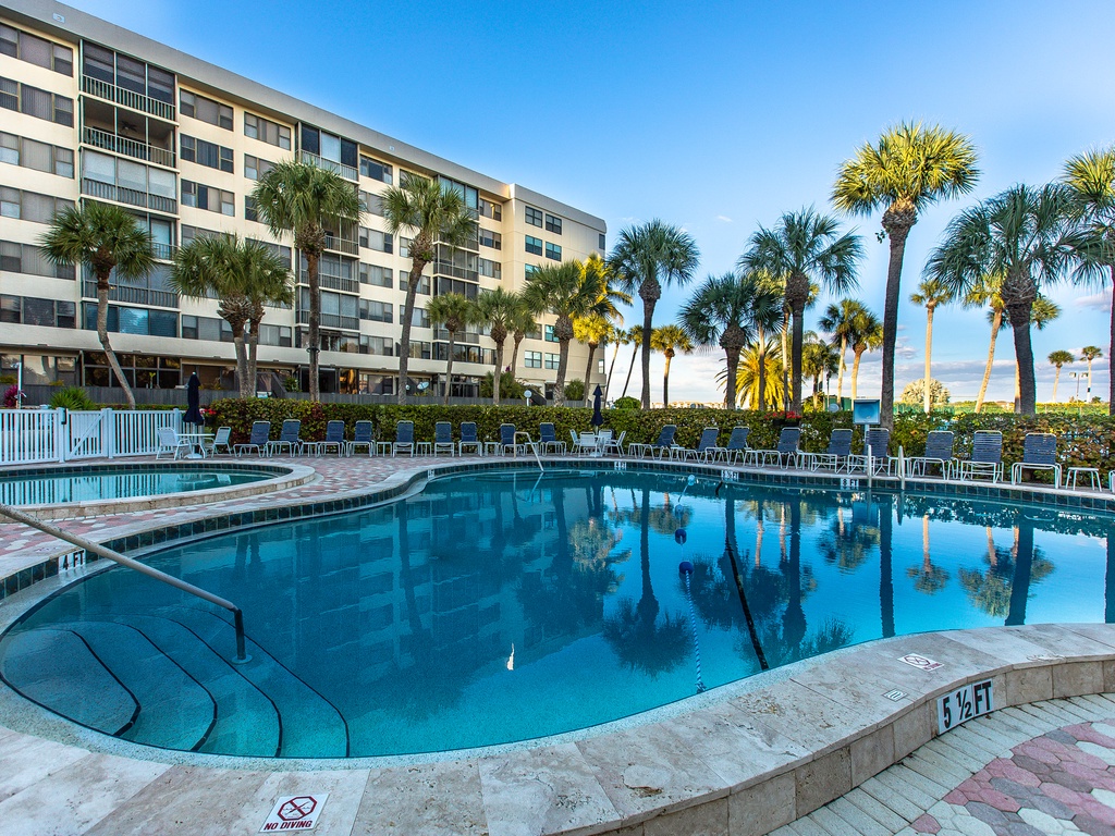 Dive into crystal-clear waters surrounded by swaying palms and modern comfort at your tropical escape.