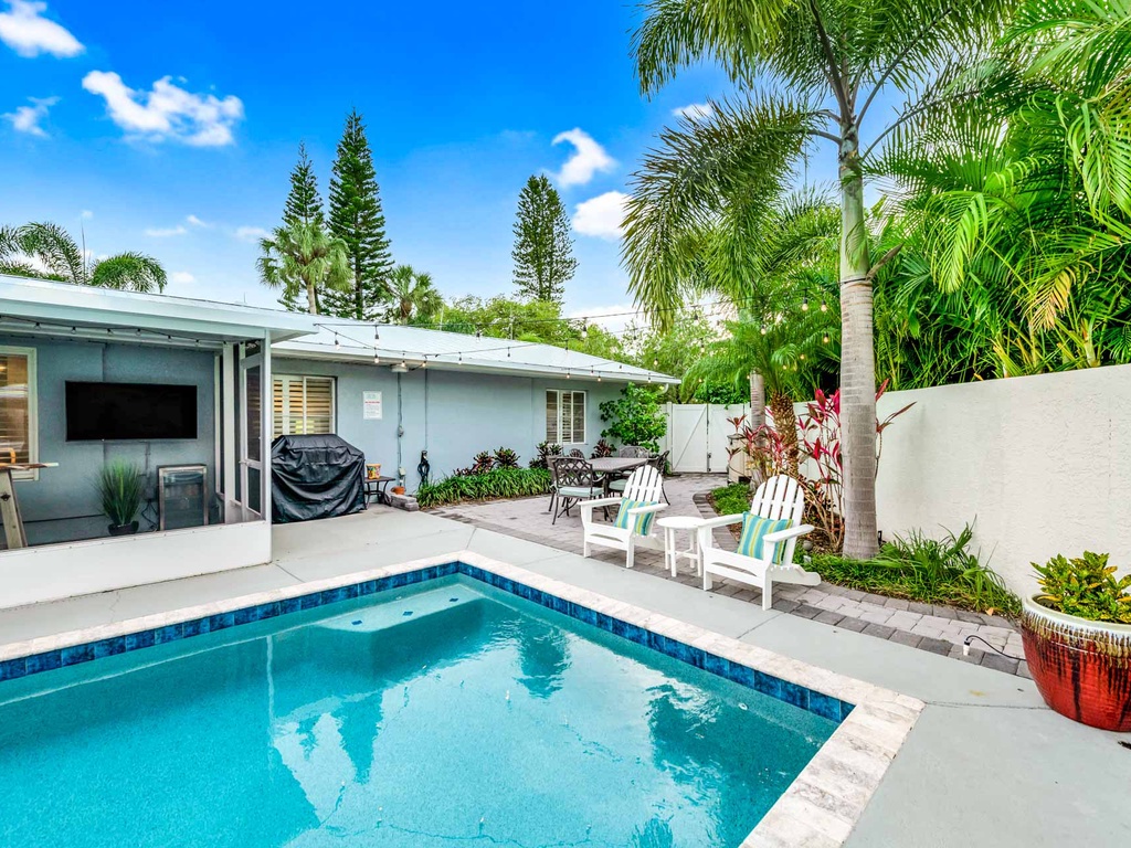 Private pool with outdoor seating and BBQ grill