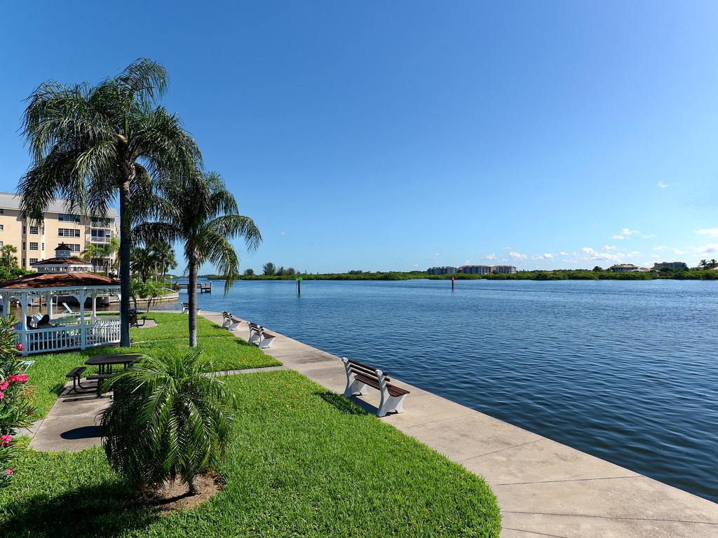 Waterfront property offering direct access to pristine bay waters with tropical landscaping and nearby amenities.