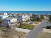 Aerial View of House with Ocean in Background