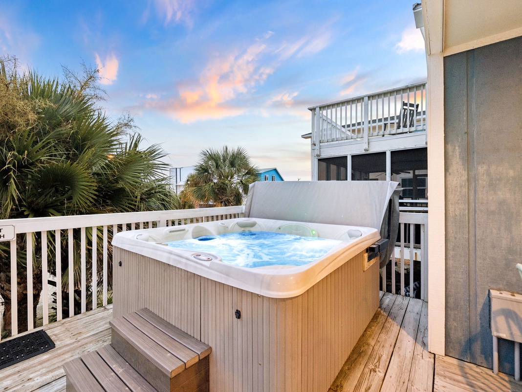 Soak in your private hot tub as the sun sets, surrounded by swaying palms and a coastal breeze that invites pure relaxation.