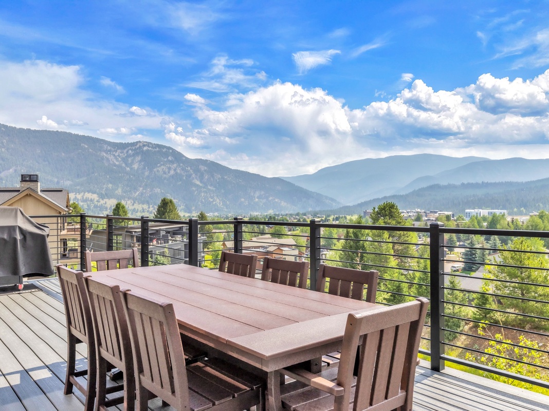 Gather around this spacious outdoor dining table and take in stunning mountain vistas—your private deck offers fresh air, majestic peaks, and the perfect backdrop for memorable meals under open skies.