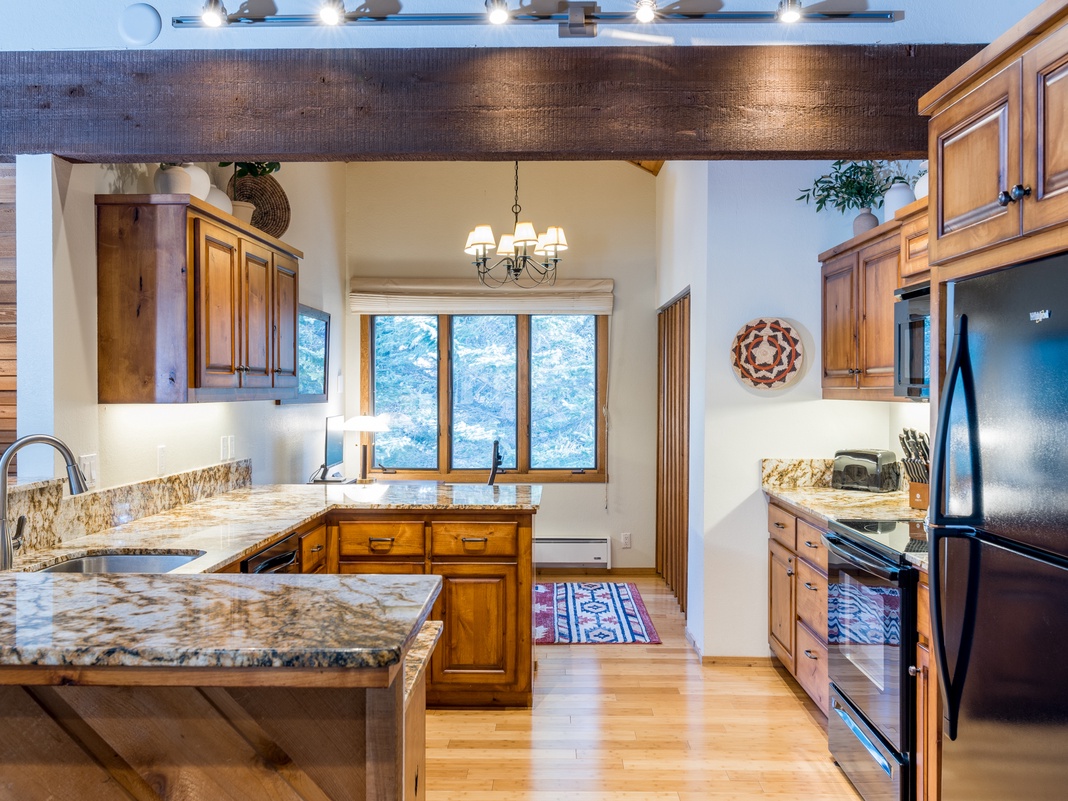 Your gourmet kitchen features granite countertops, stainless steel appliances, and rustic wood cabinets—perfect for creating memorable meals together.