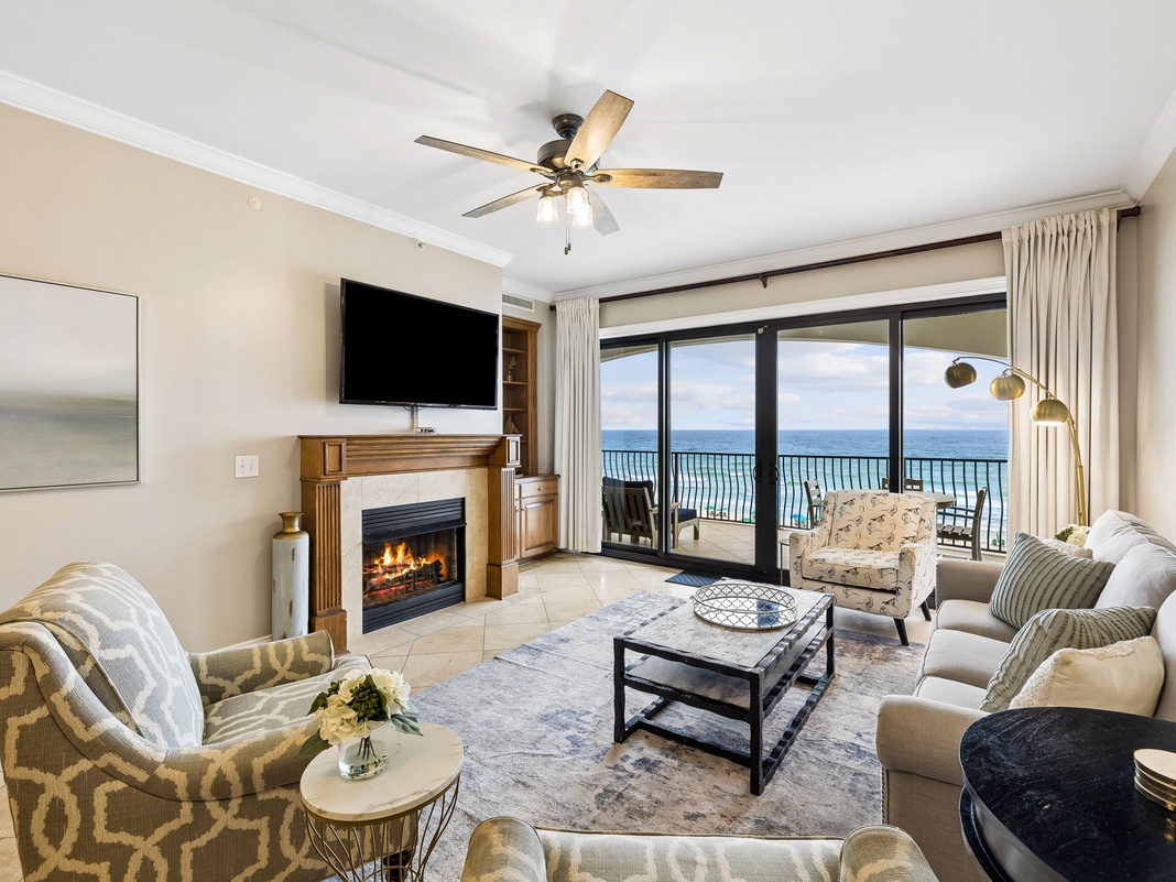 Unwind in your serene living space with sweeping ocean views and a cozy fireplace. Perfect for relaxing evenings after sun-soaked beach days.
