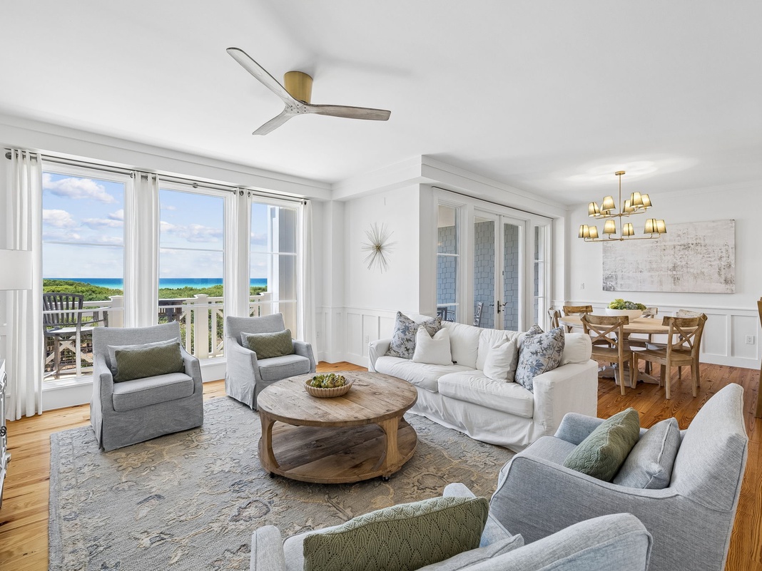 Unwind in your bright coastal living space with sweeping sea views, comfortable seating, and an open layout that flows seamlessly to your private balcony overlooking turquoise waters.
